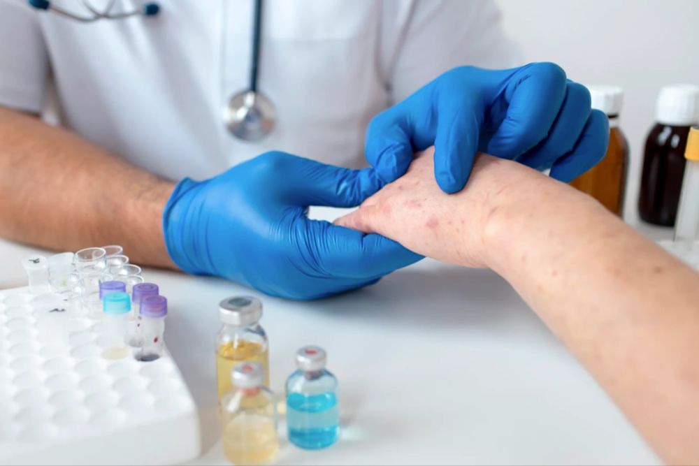 Dermatologist examining a patient's skin